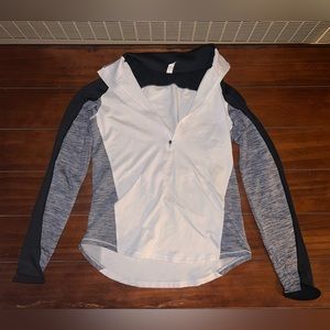 Under Armour jacket colors white, gray and black size medium and slightly worn.